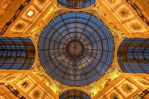 Milan Vittorio Emanuele II Gallery in Milan, Italy. It is Italy's oldest active shopping mall and a major landmark of Milan, Italy. photo