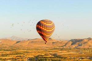 Hot air balloons over Cappadocia, Central Anatolia, Turkey photo