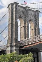 Gothic arches and tower of the Brooklyn Bridge. photo