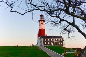 The Montauk Point Lighthouse located adjacent to Montauk Point State Park, at the easternmost point of Long Island, in the hamlet of Montauk in the Town of East Hampton in Suffolk County, New York. photo