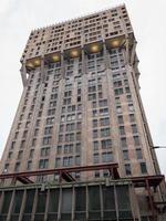 Milan, Italy - March 18, 2018 -  Torre Velasca is a skyscraper built in 1958, first 18 floors shops and offices and the subsequent to 26th are apartments, in Velasca square, Milan, Italy. photo