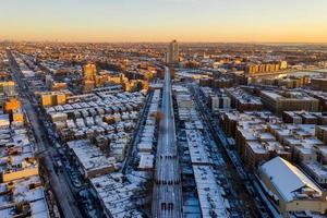 Aerial view of a snow covered Coney Island Beach during the winter at sunrise in Brooklyn, New York photo