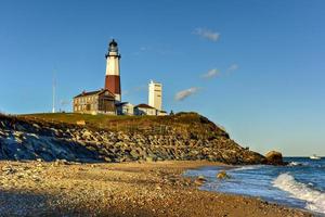 The Montauk Point Lighthouse located adjacent to Montauk Point State Park, at the easternmost point of Long Island, in the hamlet of Montauk in the Town of East Hampton in Suffolk County, New York. photo