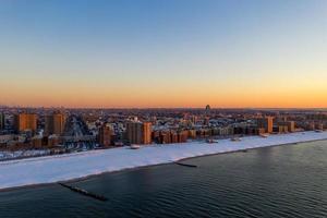 Aerial view of a snow covered Coney Island Beach during the winter at sunrise in Brooklyn, New York photo