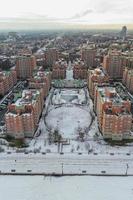 Aerial view of a snow covered Coney Island Beach during the winter at sunset in Brooklyn, New York photo