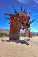 Borrego Spring, CA - July 12, 2020 -  Outdoor metal sculpture of a mythical serpent, close to Anza-Borrego Desert State Park. photo