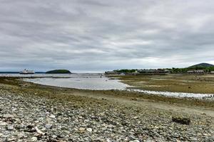 Dirt path to Bar Island at low-tide at Bar Harbor in Acadia National Park, Maine photo