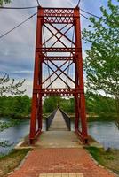 The Androscoggin Swinging Bridge is a pedestrian suspension bridge spanning the Androscoggin River between the Topsham Heights neighborhood of Topsham, Maine and neighboring Brunswick. photo