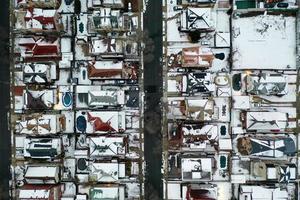 Aerial top-down view of homes and pools on a winter day. photo