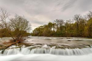 The American Falls at Niagara Falls, New York viewed from Goat Island on a cloudy day. photo