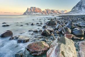 Dawn at Utakleiv Beach, Lofoten Islands, Norway in the winter. photo