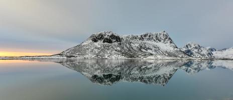 Vagspollen reflection at sunrise in the Lofoten Islands, Norway in the winter. photo