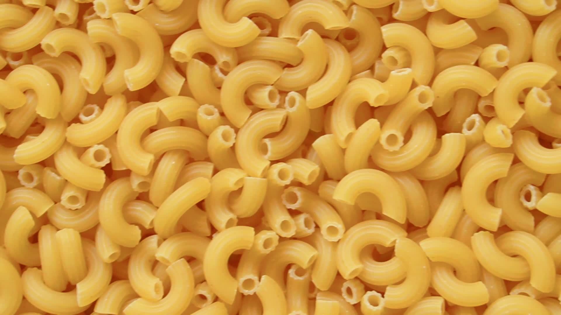Full screen uncooked raw elbow macaroni 16171672 Stock Video at Vecteezy