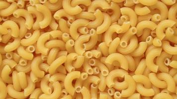 Full screen uncooked raw elbow macaroni video