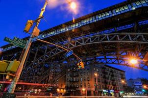 Elevated train tracks at the 125th Street Subway Station and Broadway in New York City. photo