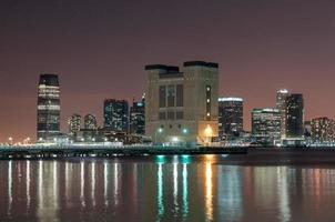 Jersey City, New Jersey skyline and the Lincoln Tunnel at night from Manhattan photo