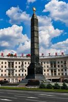 Minsk, Belarus - July 21, 2019 -  Monument in honor of the victory in World War II at Victory Square in Minsk, Belarus. Red letters read Heroic deed of the people is immortal. photo