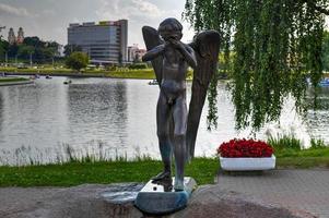 Minsk, Belarus - July 21, 2019 -  Sculpture of crying guardian angel on Island of Tears, Minsk, Belarus. photo