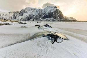 Scenic pebble beach in Eggum, Lofoten Islands, Arctic, Norway, Scandinavia, Europe on a cloudy, winter day. photo