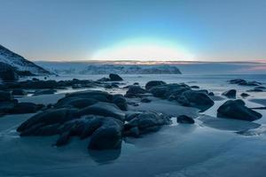 Vikten Beach in the Lofoten Islands, Norway in the winter at sunset. photo