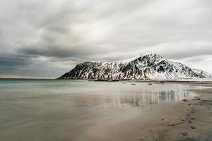 Skagsanden Beach in the Lofoten Islands, Norway in the winter on a cloudy day. photo