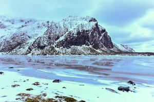 Scenic pebble beach in Eggum, Lofoten Islands, Arctic, Norway, Scandinavia, Europe on a cloudy, winter day. photo