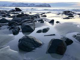 Vikten Beach in the Lofoten Islands, Norway in the winter at sunset. photo