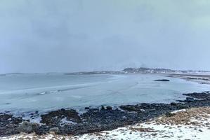 Sandbotnen Beach in the Lofoten Islands, Norway in the winter on a cloudy day. photo