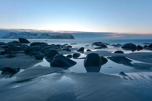 Vikten Beach in the Lofoten Islands, Norway in the winter at sunset. photo