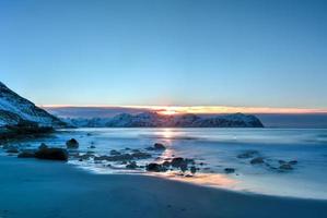 Vikten Beach in the Lofoten Islands, Norway in the winter at sunset. photo