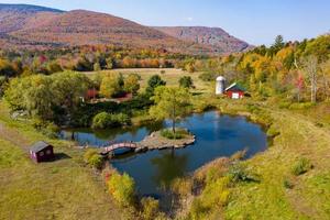 Idyllic farm in upstate New York during peak fall foliage. photo