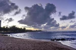 Beach with waves crossing against the rocks off of San Juan, Puerto Rico. photo