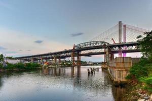 New and old Kosciuszko bridges joining Brooklyn and Queens in New York City across Newtown Creek. The new bridge is a cable-stayed bridge while the old bridge from 1939 is truss bridge. photo