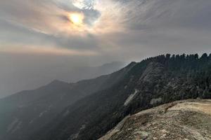 View from Moro Rock at Sequoia National Park with hazy mountains in background following California wildfires. photo