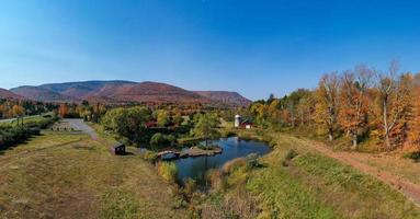 Idyllic farm in upstate New York during peak fall foliage. photo