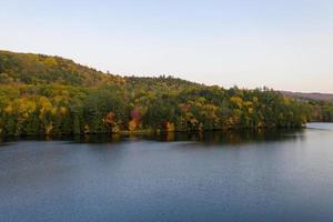 Aerial view of Amherst Lake in fall foliage in Plymouth, Vermont. photo