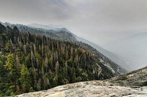 View from Moro Rock at Sequoia National Park with hazy mountains in background following California wildfires. photo