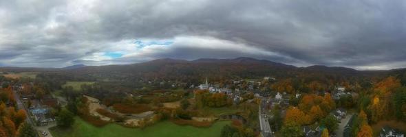 Stowe panorama in Autumn with colorful foliage and community church in Vermont. photo