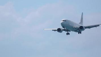 PHUKET, THAILAND NOVEMBER 27, 2015 - Boeing 737 of City Airways flies in the sky overhead. Low angle view of passenger airplane approaching from sea. video