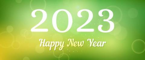 Happy new year 2023 incription on blurred background vector