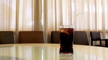 Cola in glass with motion background video
