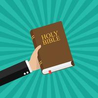Hand holding holy bible vector