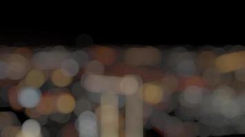 City at the night abstract bright defocused colored bokeh. video
