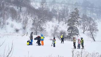 Bakuriani, Georgia, 2022 - Group of children learn to ski in Bakuriani ski academy, Georgia video