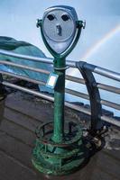 A viewing platform with a view of the falls in the background. photo