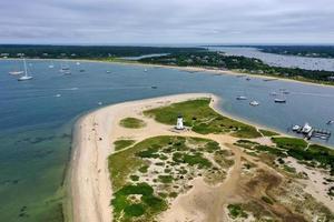 Edgartown Harbor Lighthouse at the entrance into Edgartown Harbor and Katama Bay, Martha's Vineyard, Massachusetts, USA. The historic lighthouse was built in 1828. photo