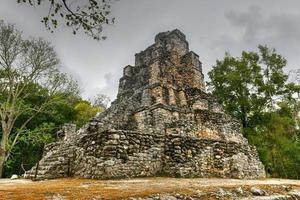 Muyil Mayan Ruins of a pyramid in Sian Kaan near Tulum, Mexico. photo