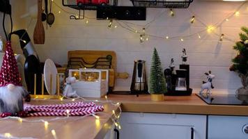 Woman puts it on table and takes food delivery service containers on table white scandi festive kitchen in christmas decor. Eve New year, saving time, too lazy to cook, hot order, plastic box video