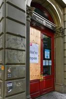 New York City, New York - June 11, 2020 -  Store closed during the COVID-19 pandemic, with boarded up windows to protect against looting as a result of anti-police brutality protests. photo