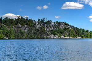 Massive rocks and view to the valley at Minnewaska State Park Reserve Upstate NY during summer time. photo